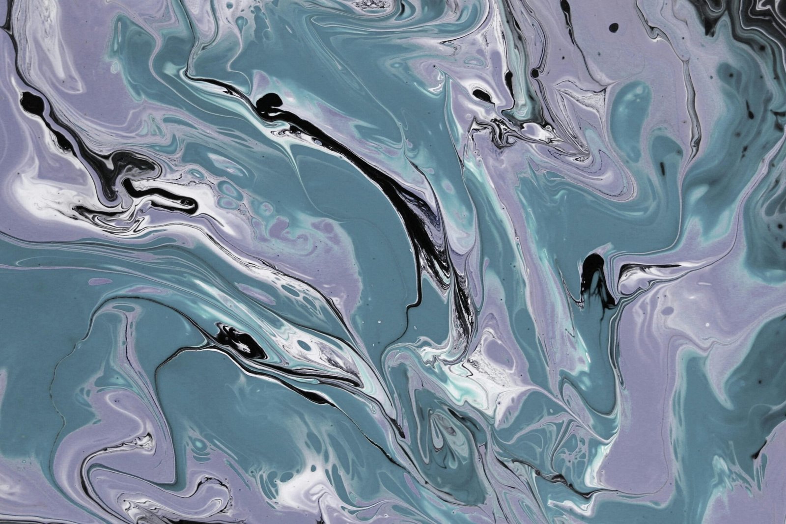 Dynamic abstract marble swirl art in cool teal, purple, and black tones.