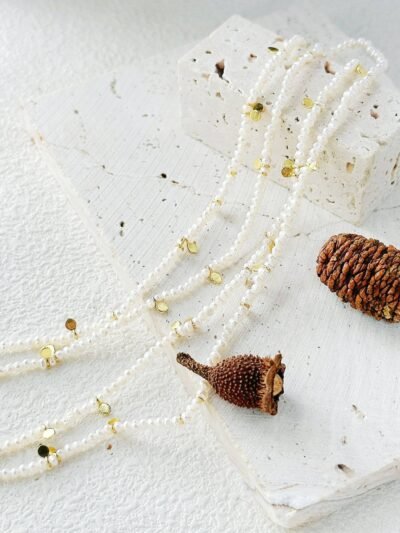 double-strand long pearl necklace with gold vermeil coin charms